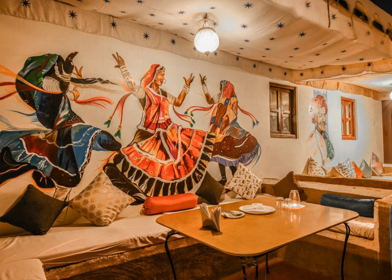 Dining lounge with Kalbeliya dancer mural