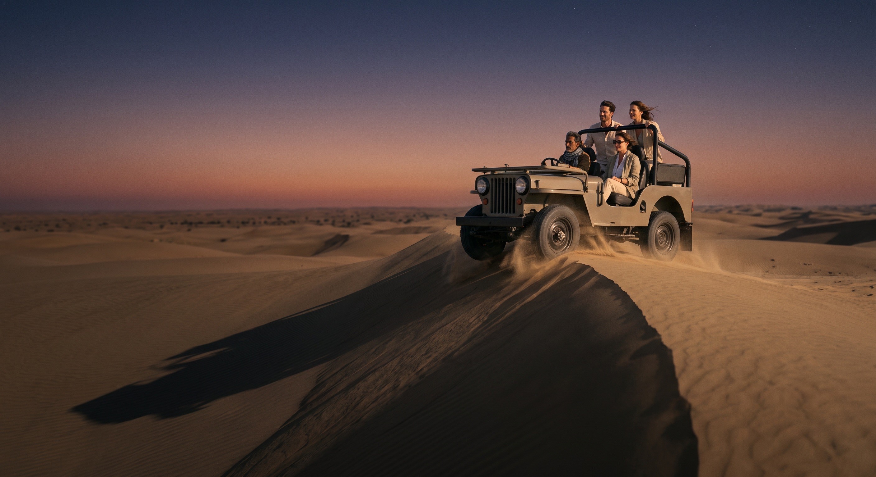 An open-top jeep with four guests cresting a dune ridge at dusk near Khuri, Jaisalmer